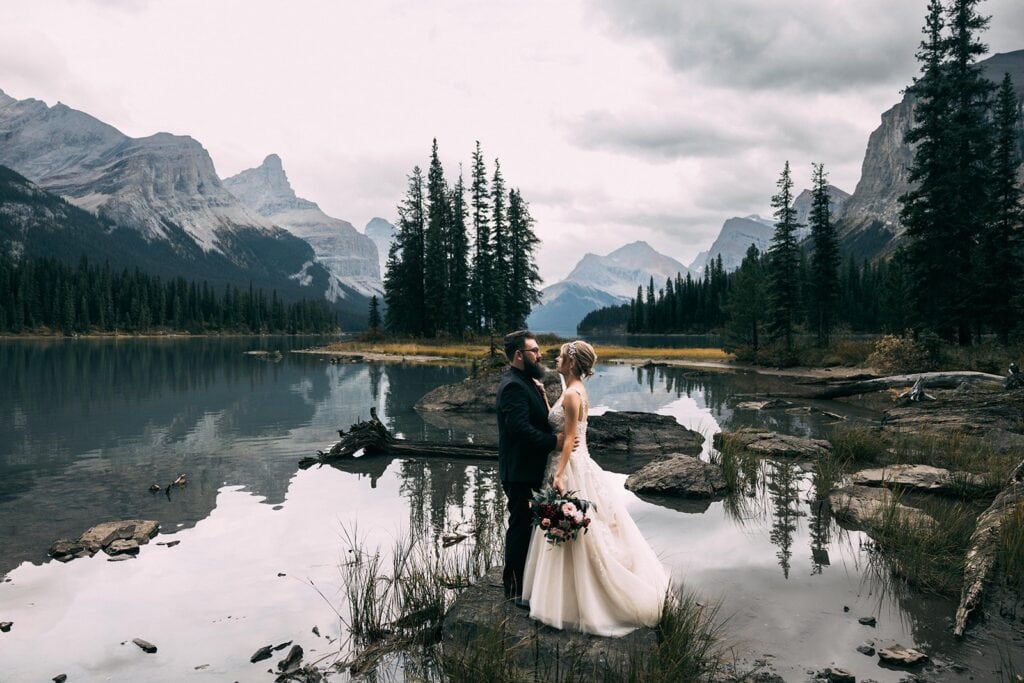 couple eloping in jasper national park at maligne lake spirit island