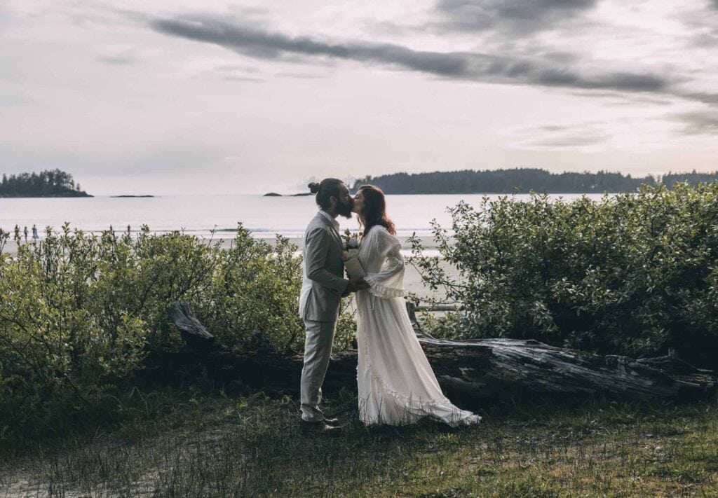 eloping in british columbia-  couple eloping along the beach in tofino 