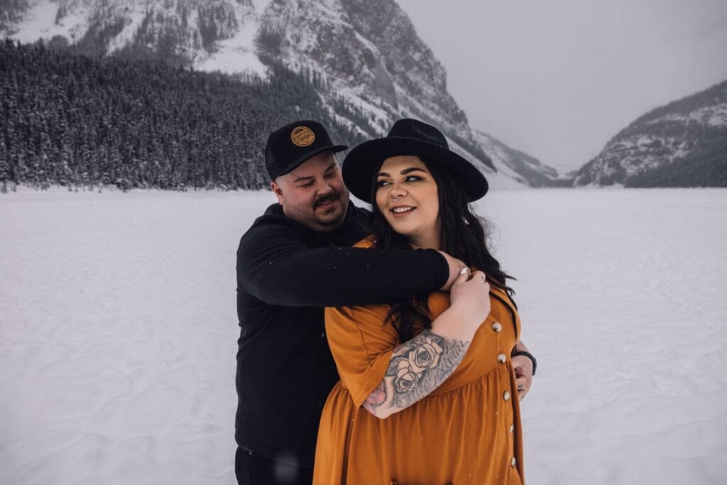couple hugging at lake louise