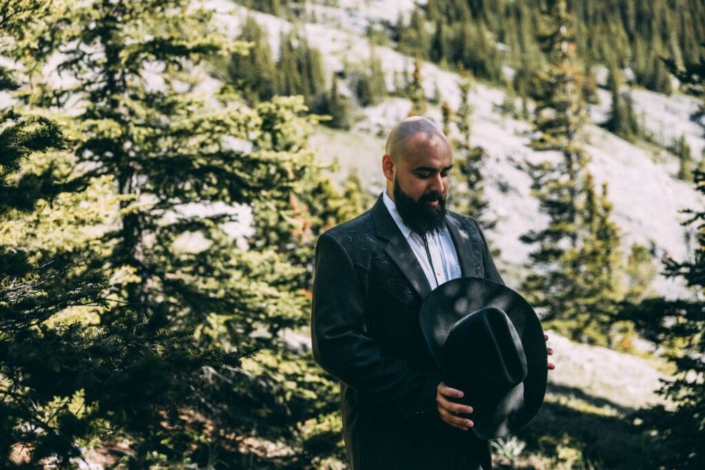 groom preparing for a first look