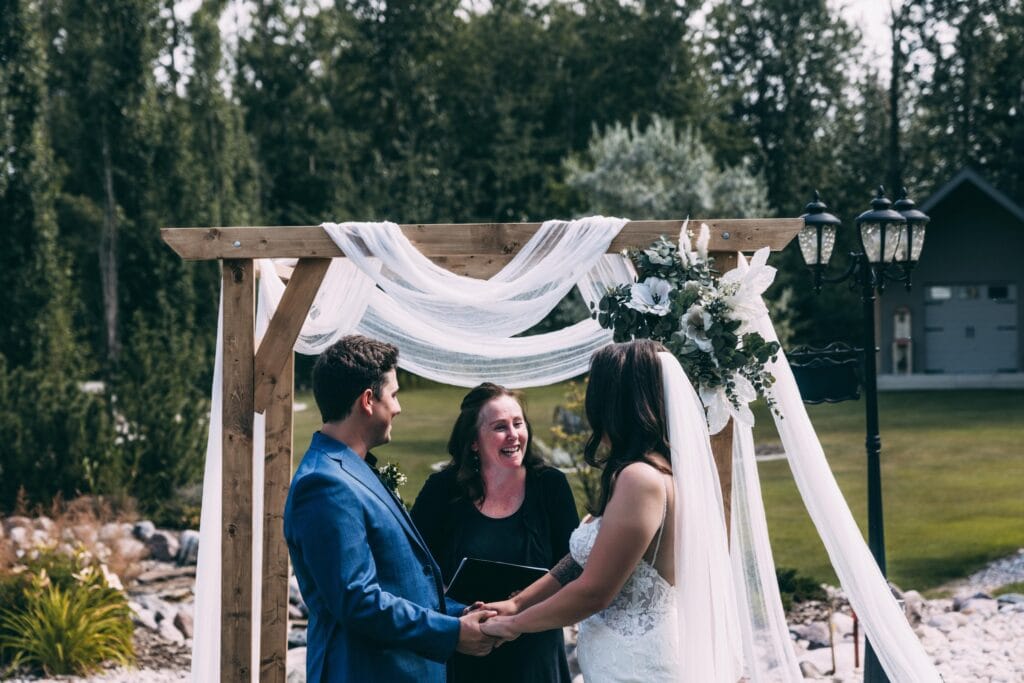 couple eloping in the backyard