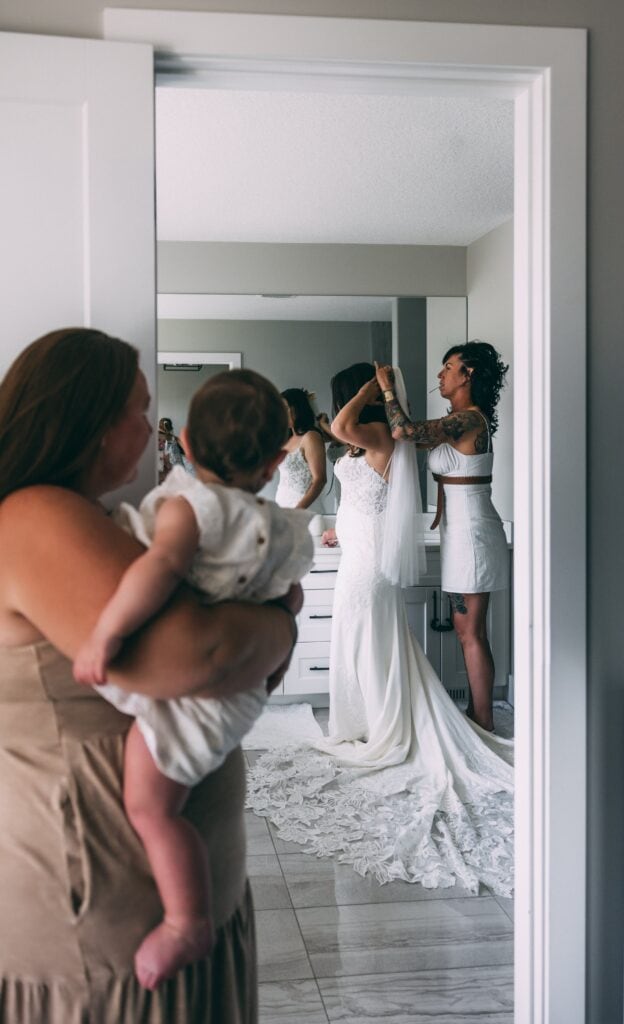 mother helping bride get ready for her edmonton elopement