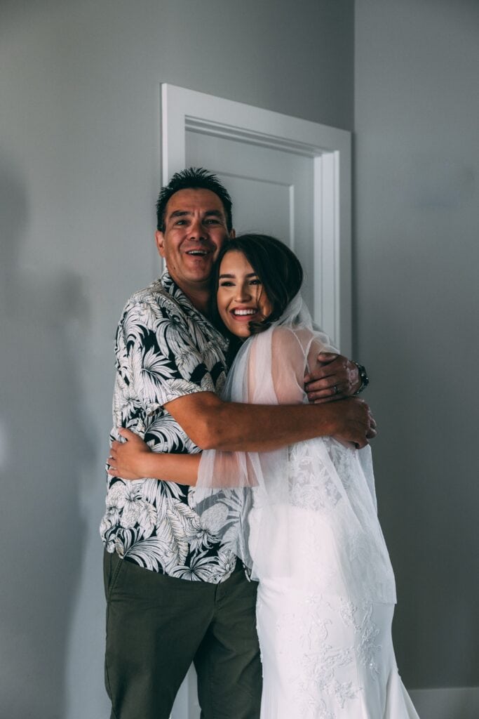 bride and dad hugging