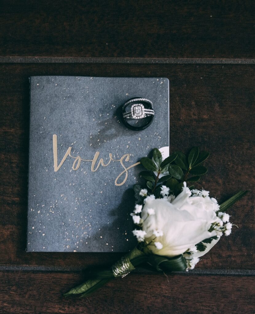 wedding vows, wedding rings and boutonniere 