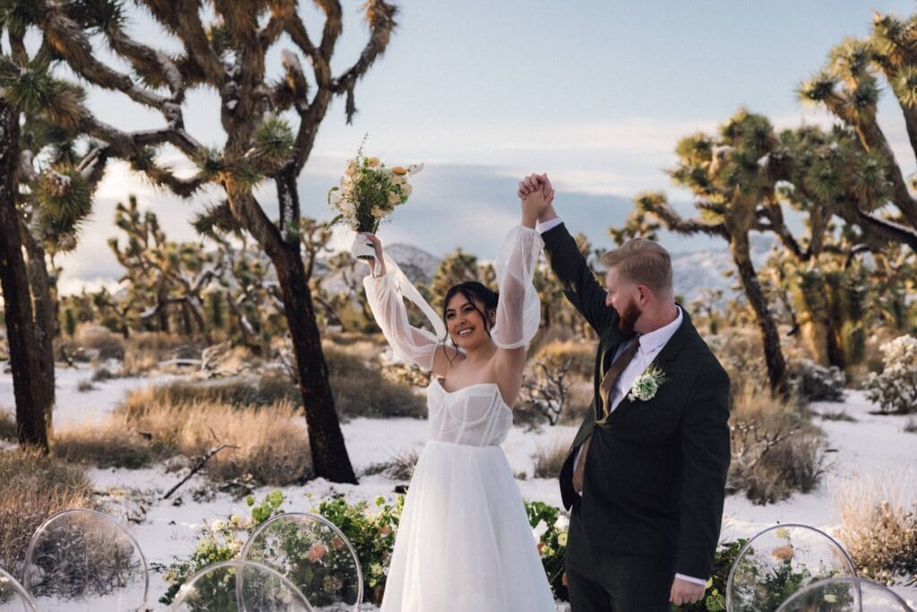 couple cheering in joshua tree