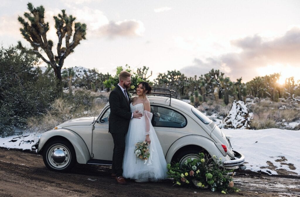 couple eloping with their buggy vehicle in joshua tree
