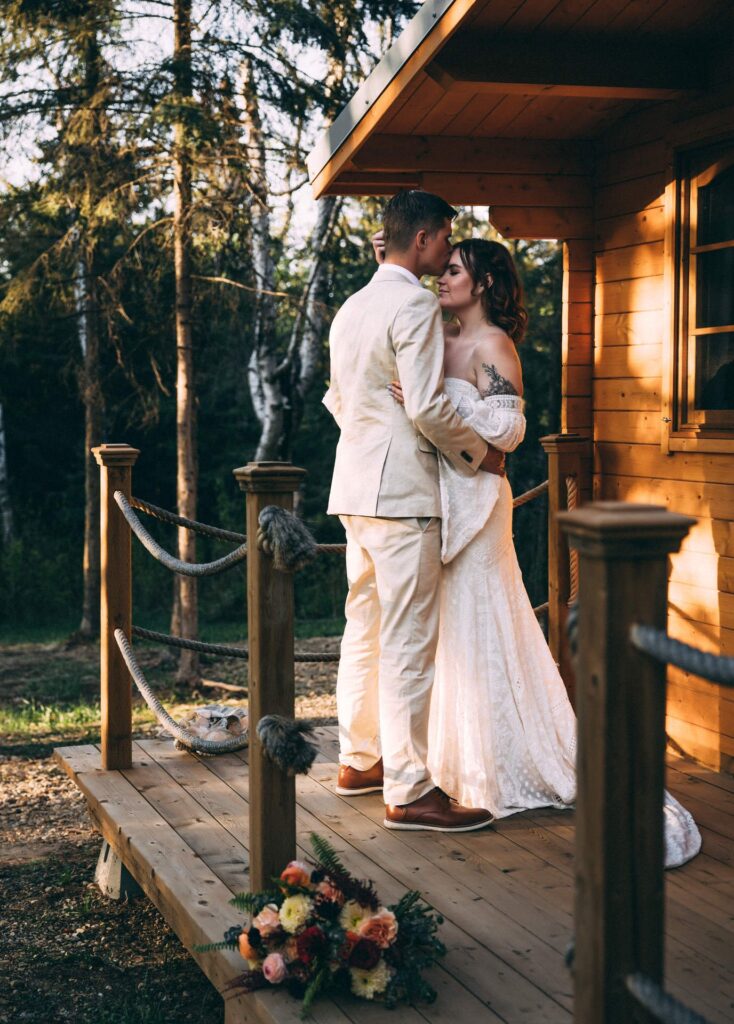 couple eloping at elk island retreat cabin