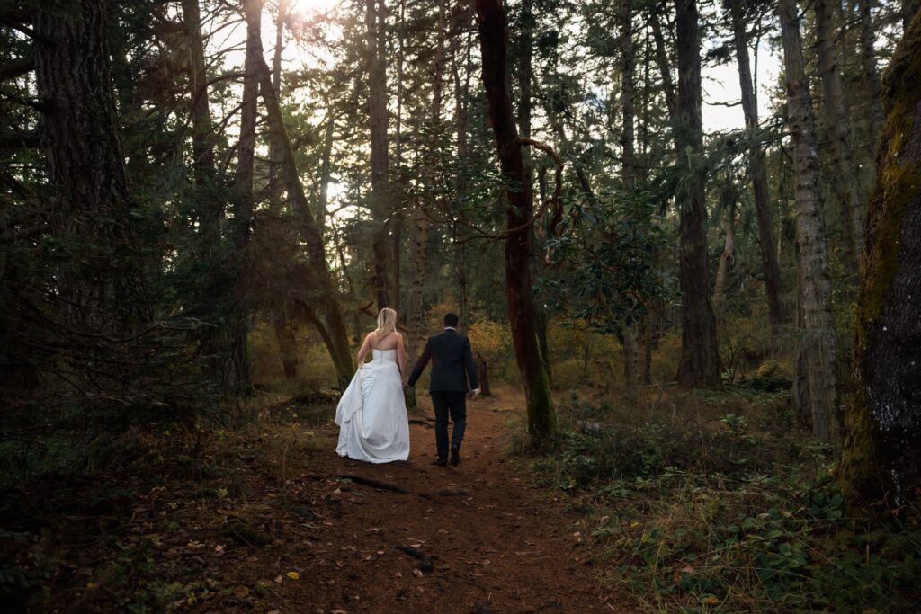 wedding couple walking in forest on vancouver island