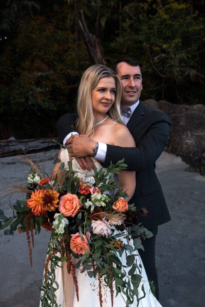wedding couple hugging in vancouver island