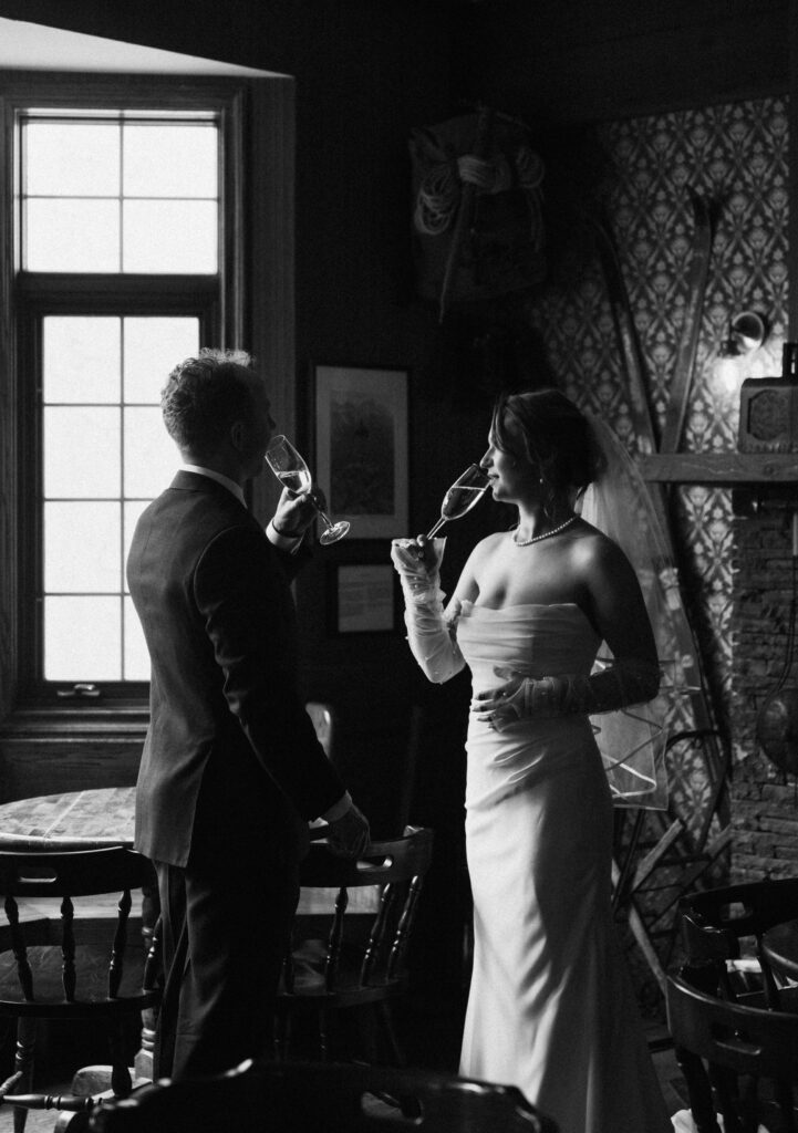 indoor elopement ideas - couple having a drink at the bar