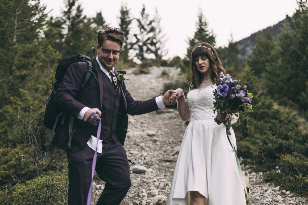 couple hiking on their elopement wedding in canmore alberta