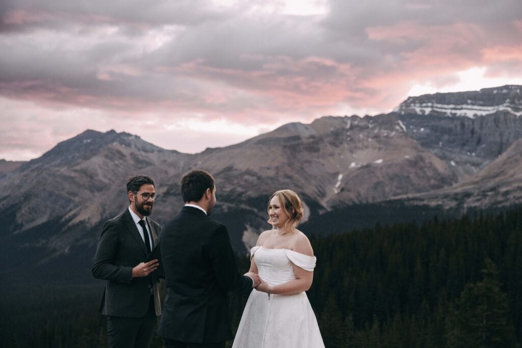 married by cole marrying couple at sunrise at peyto lake in banff national park