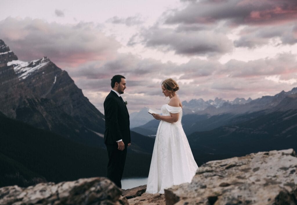couple exchanging vows at peyto lake in banff national park