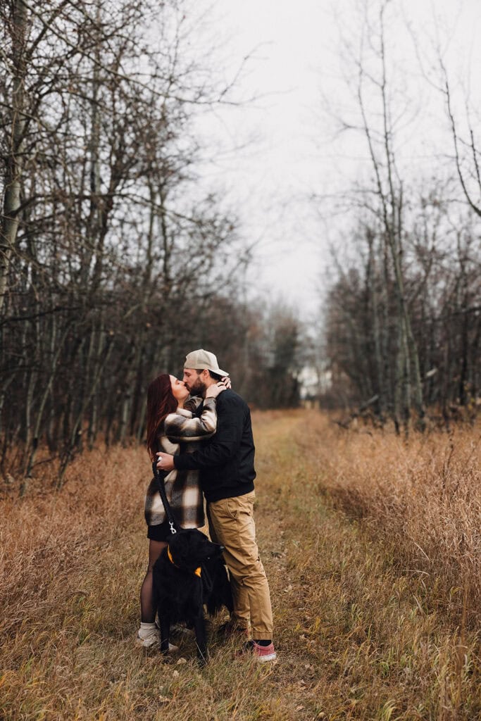 couple kissing right after he proposes