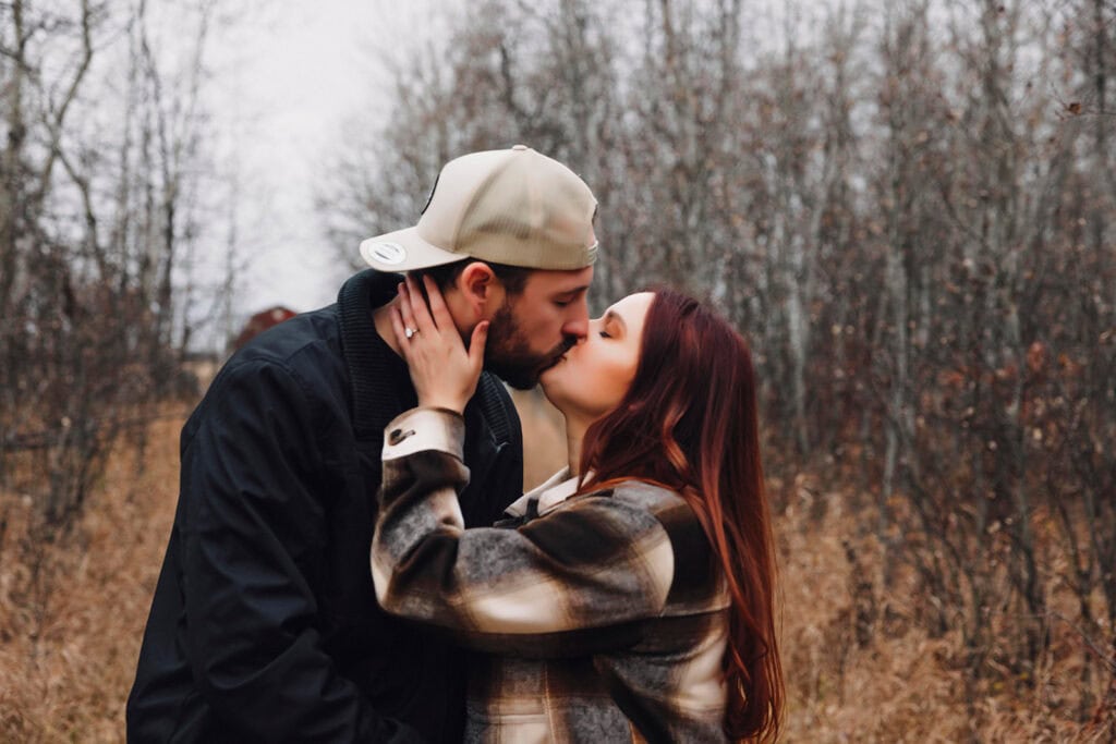 couple kissing after the surprise proposal in edmonton